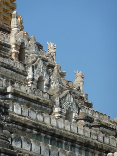 Ananda Temple - glazed jataka tiles in niches with guardian Lions on roof